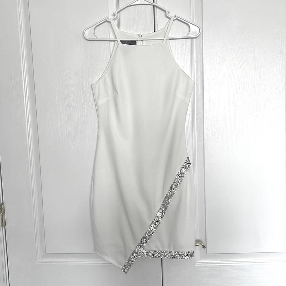 This BCX dress is a great homecoming dress with elaborate modesty and shine!